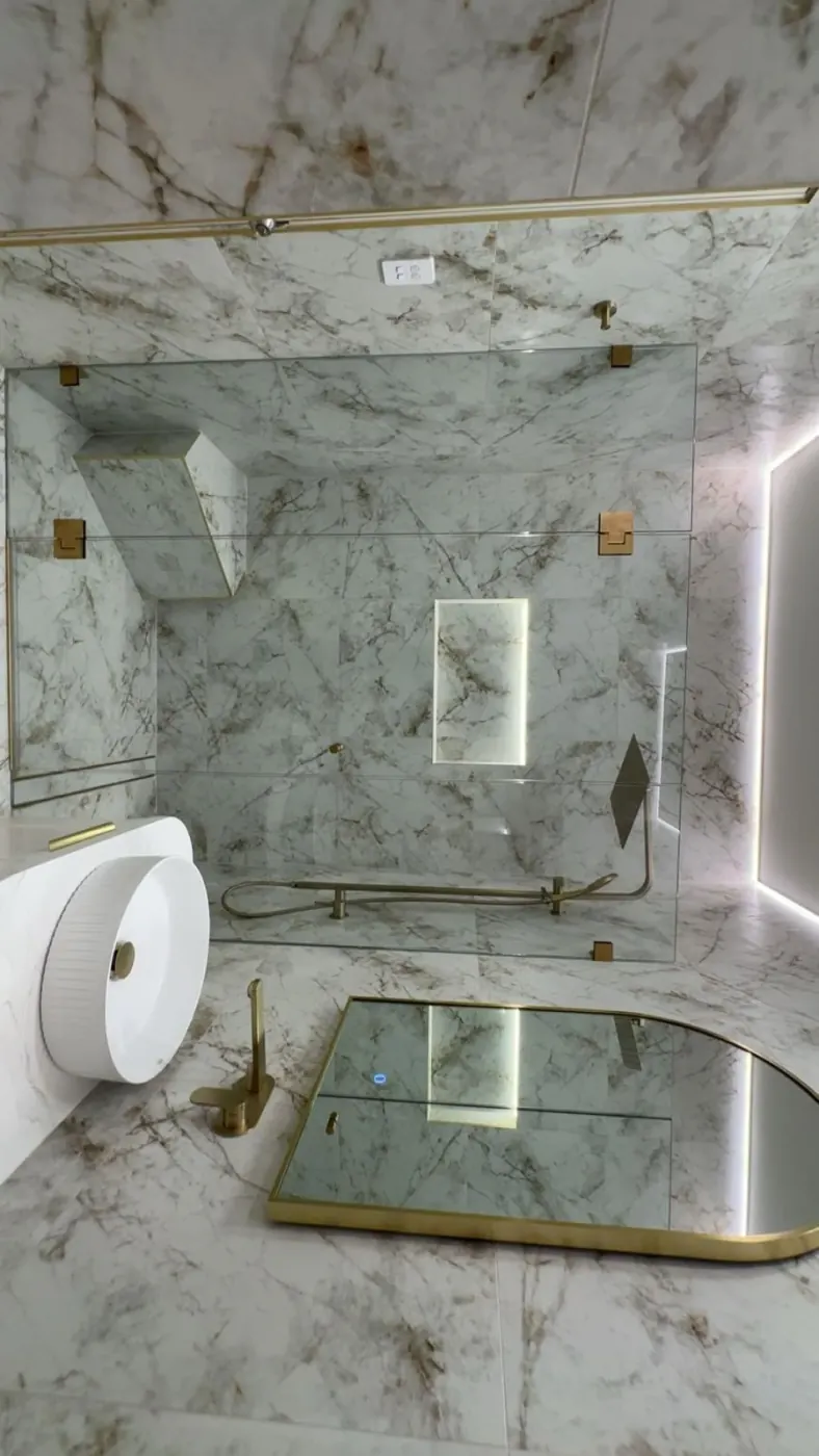 Marble bathroom with brass fittings
