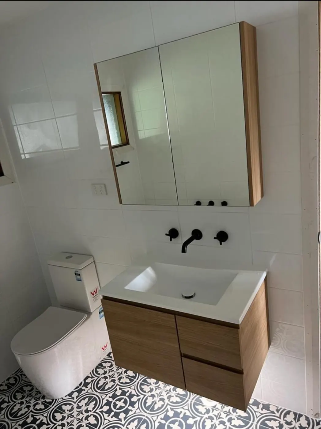Timber vanity with black tapware